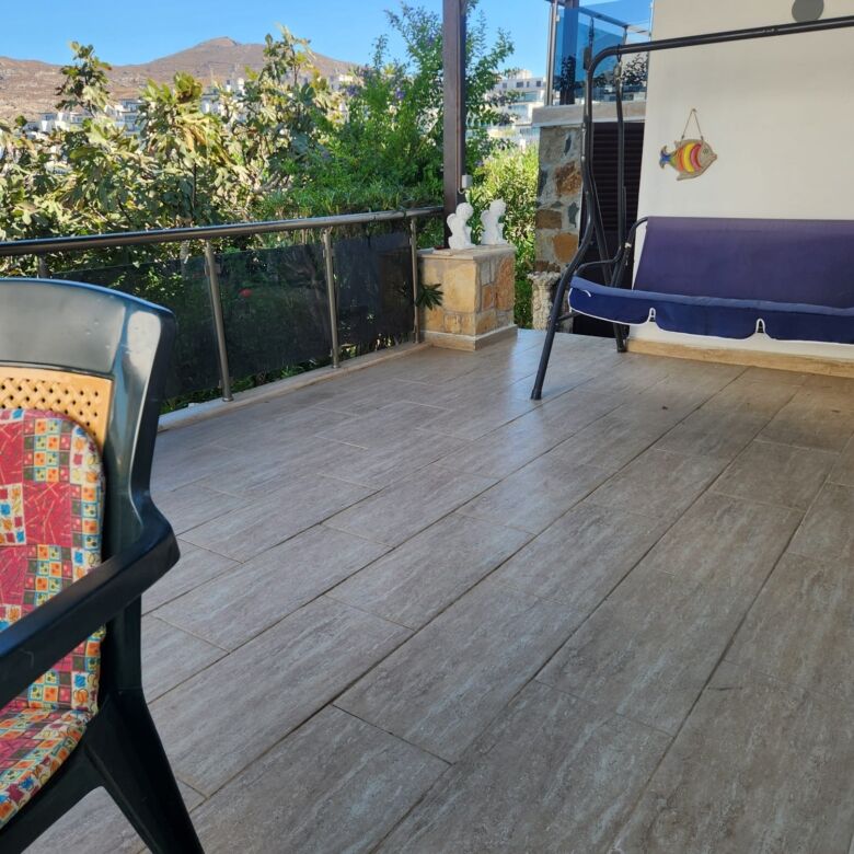 Sea view luxury 3-bedroom villa in Gumusluk with spacious terrace and modern amenities. Perfect for.