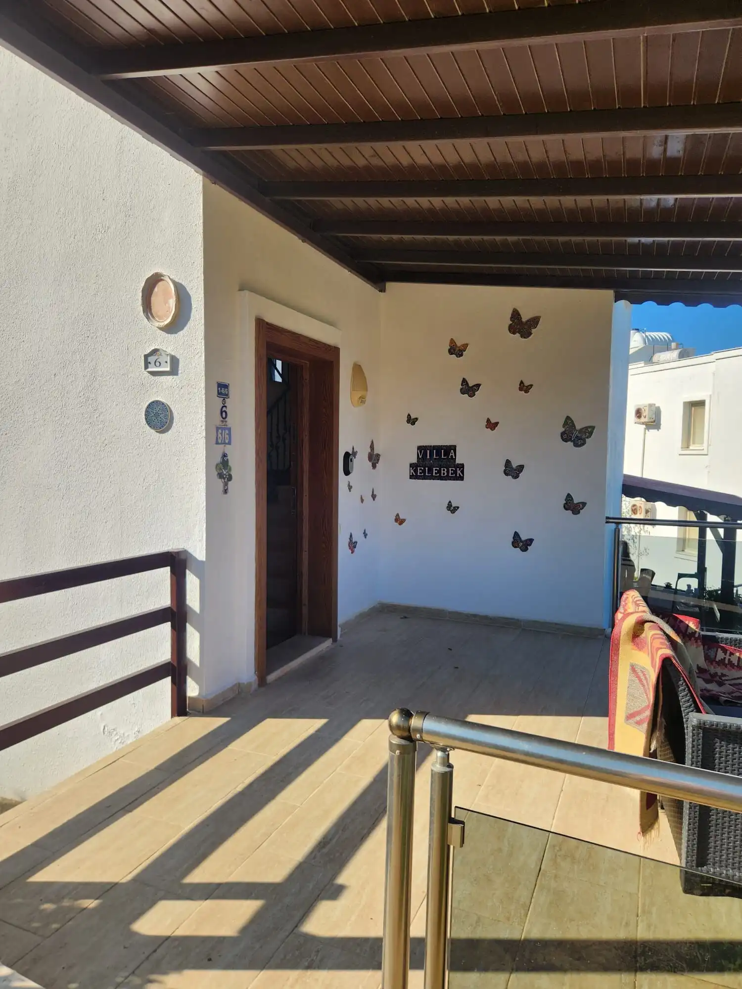 Luxury 3 Bed Villa for Sale in Grand Sea View Spacious balcony of a luxury 3-bedroom villa with sea view in Gumusluk.
