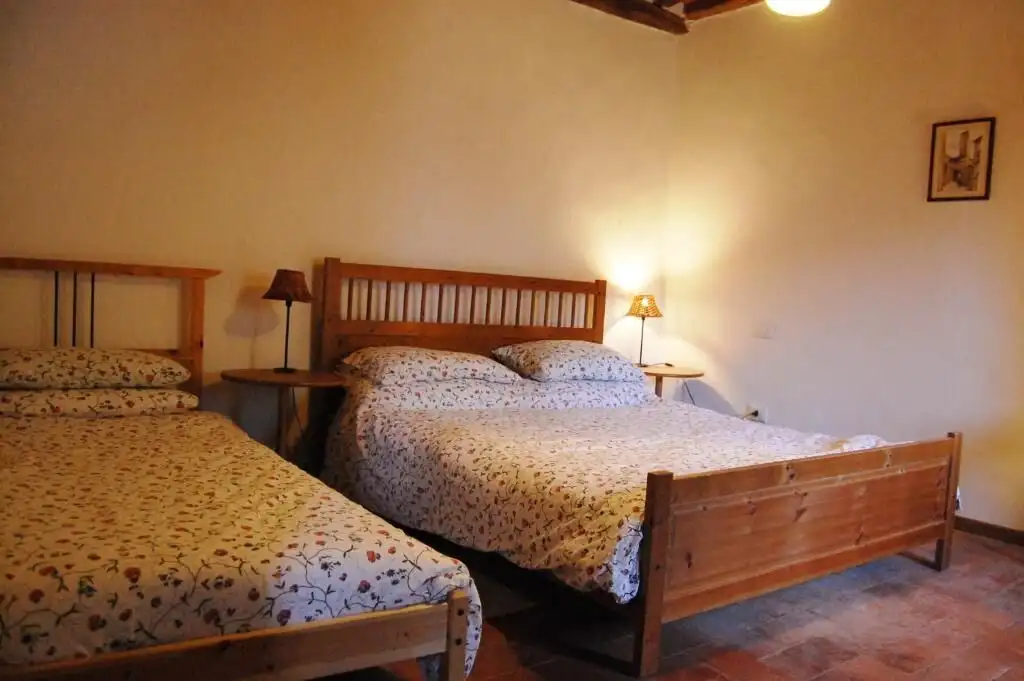 Spacious bedroom in a luxury 8-bedroom house in Bagni di Lucca, Italy. Perfect for comfortable livin.