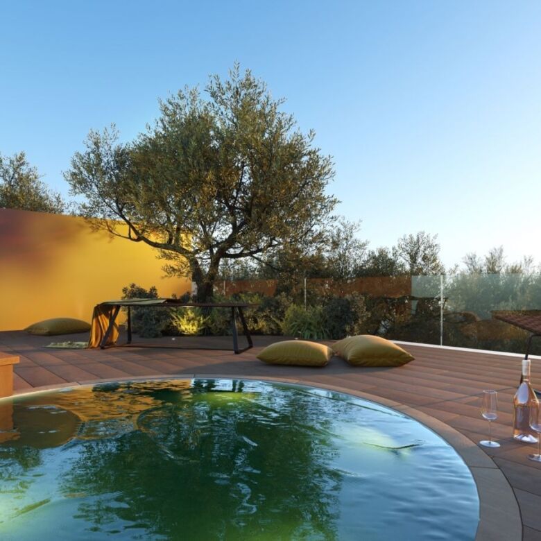 Spacious outdoor terrace with pool, sun loungers, and seating area in Carvajal, Costa del Sol.