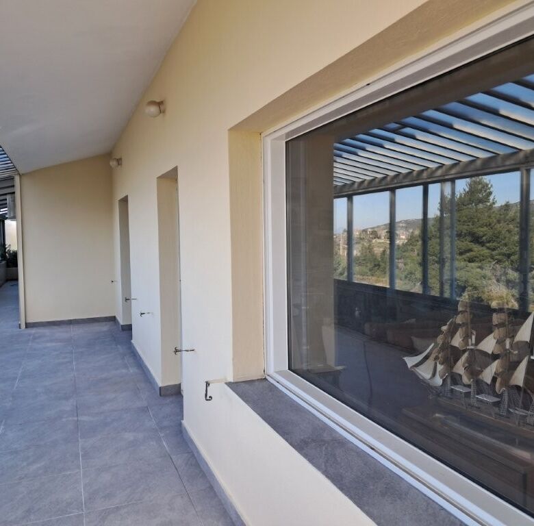 Balcony of a 4-bedroom house in Kapandriti Attica with panoramic countryside views.