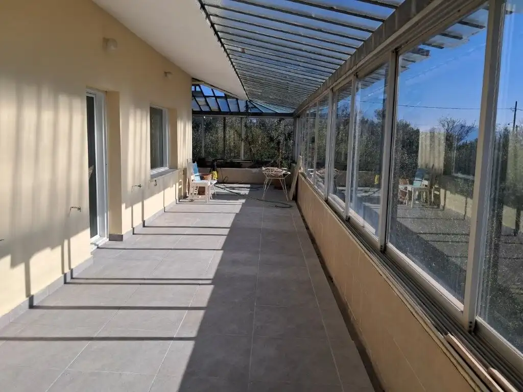 Spacious balcony with glass enclosure in a 4-bedroom home in Kapandriti, Attica, ideal for comfortab.