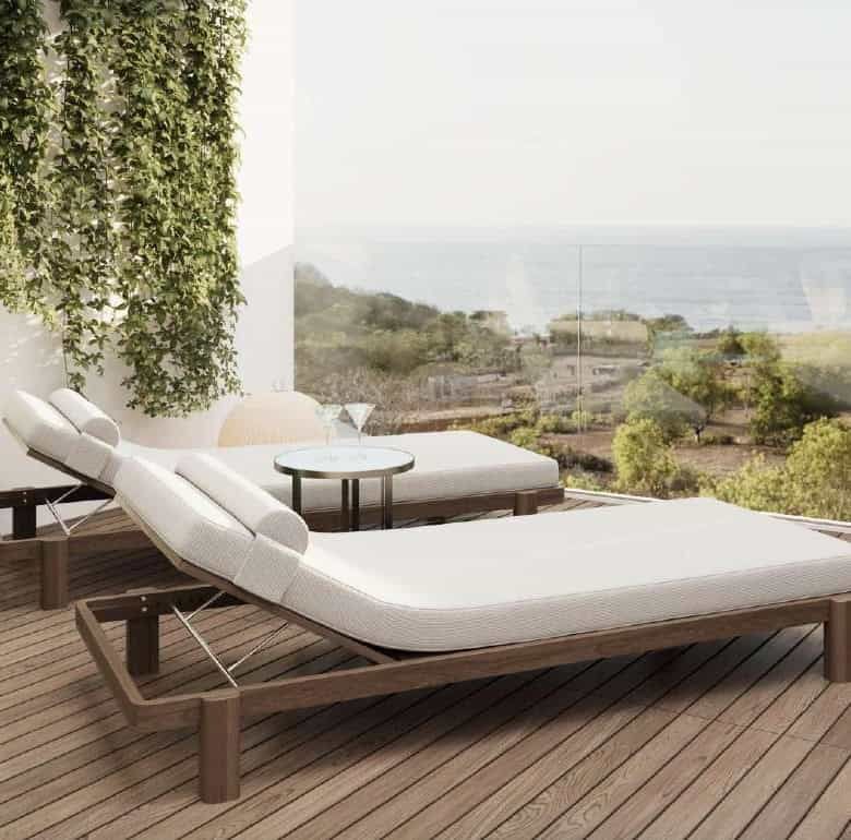 Balcony with sun loungers overlooking Bali's scenic landscape and ocean views. Perfect for relaxing.
