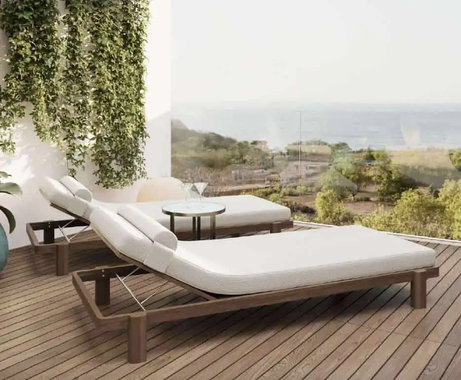 Balcony with sun loungers overlooking Bali's scenic landscape and ocean views. Perfect for relaxing.
