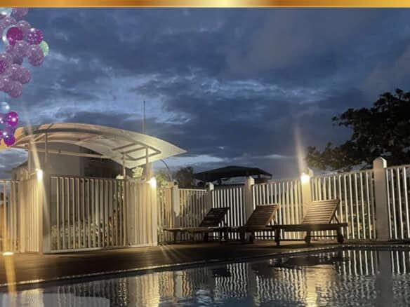 Luxury Loxwood House for Sale in Colombo, Sri Lanka, featuring a private pool and outdoor lounging a.