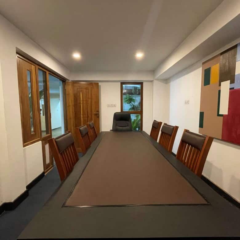 Conference room with large table and wooden chairs in Colombo, Sri Lanka.