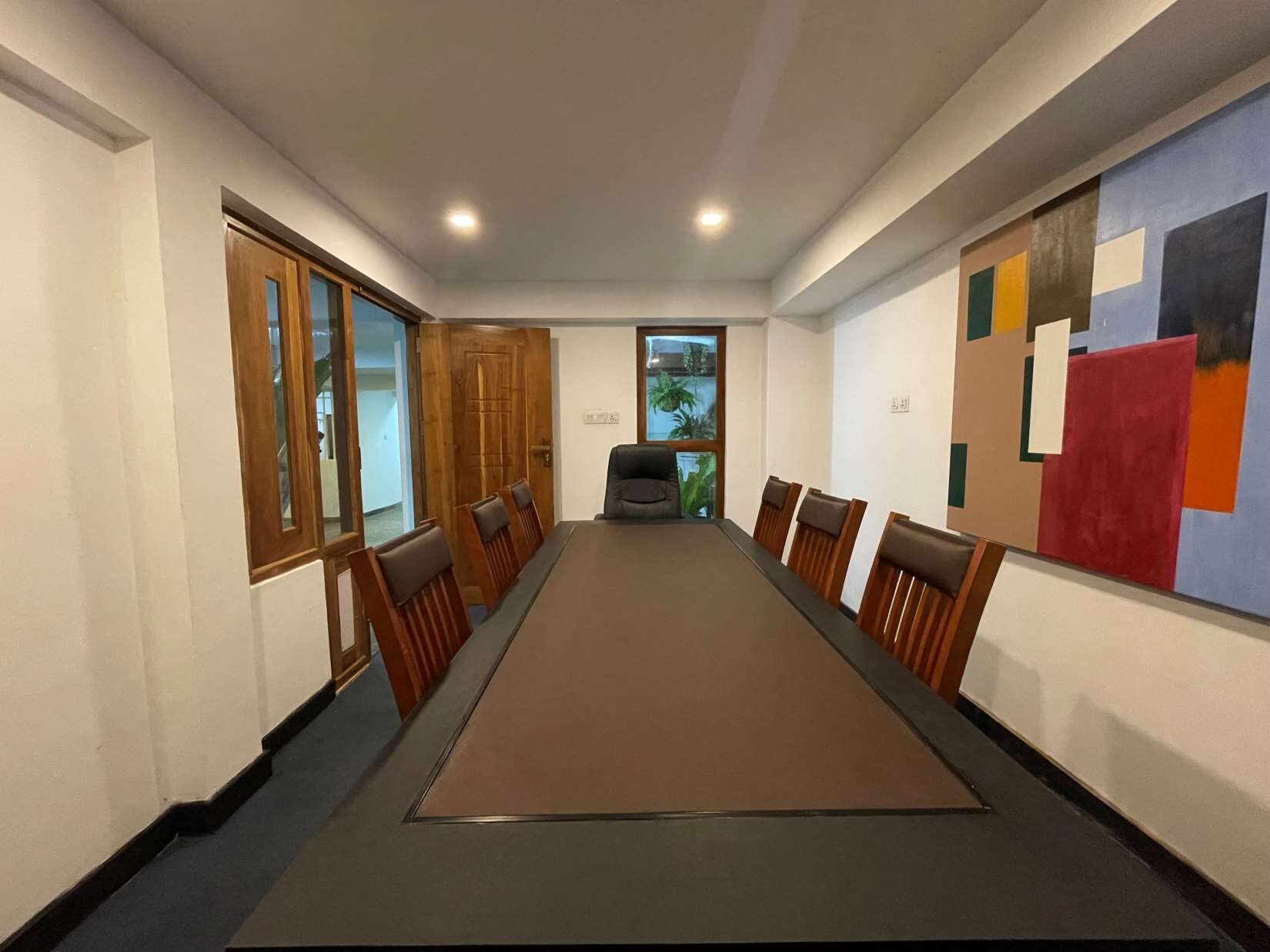 Conference room with large table and wooden chairs in Colombo, Sri Lanka.