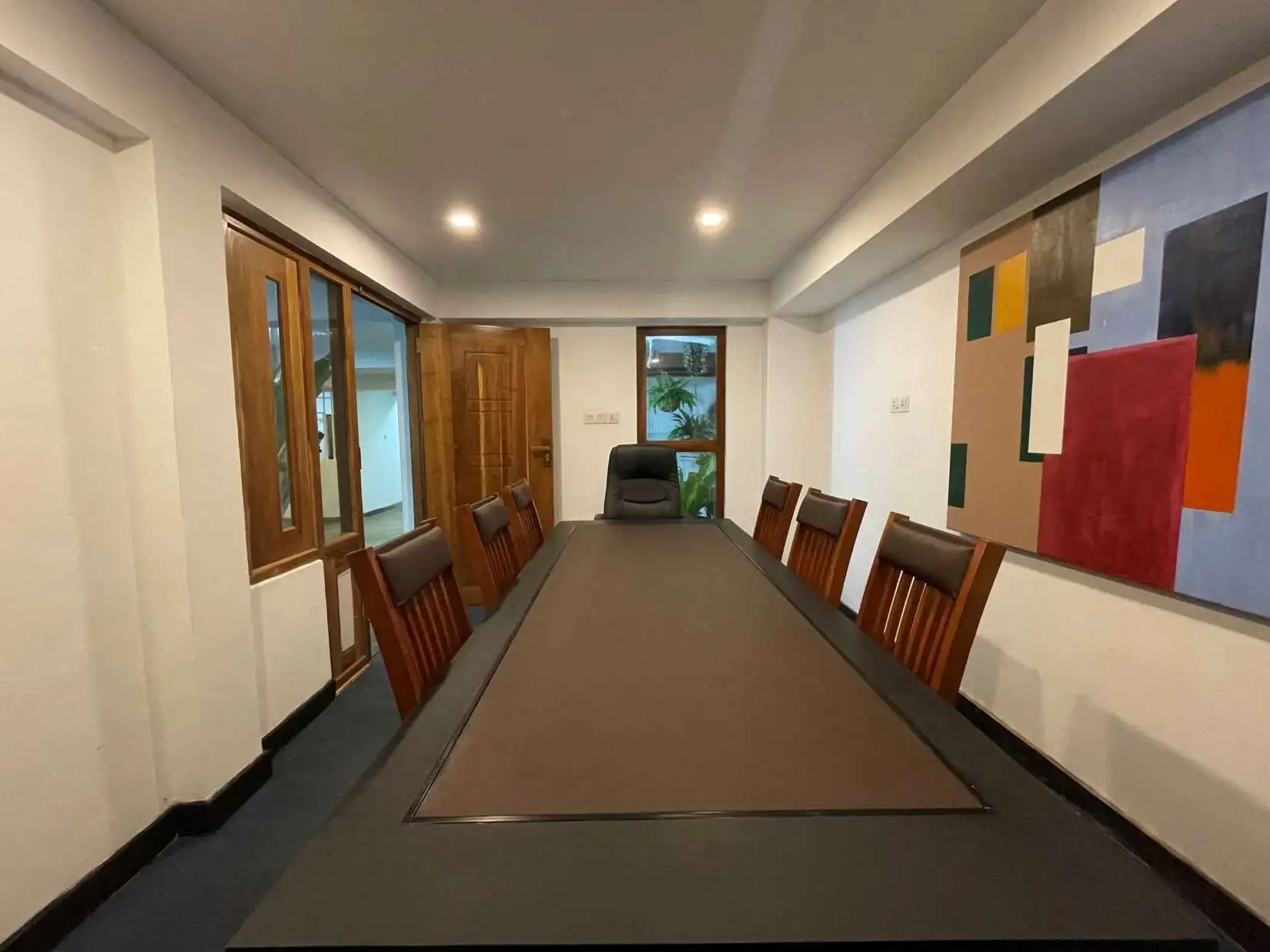 Conference room with large table and wooden chairs in Colombo, Sri Lanka.