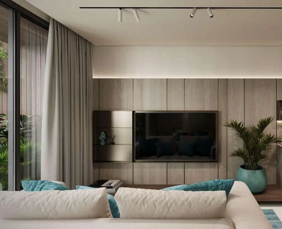 Modern Bali apartment living room with TV and stylish decor.