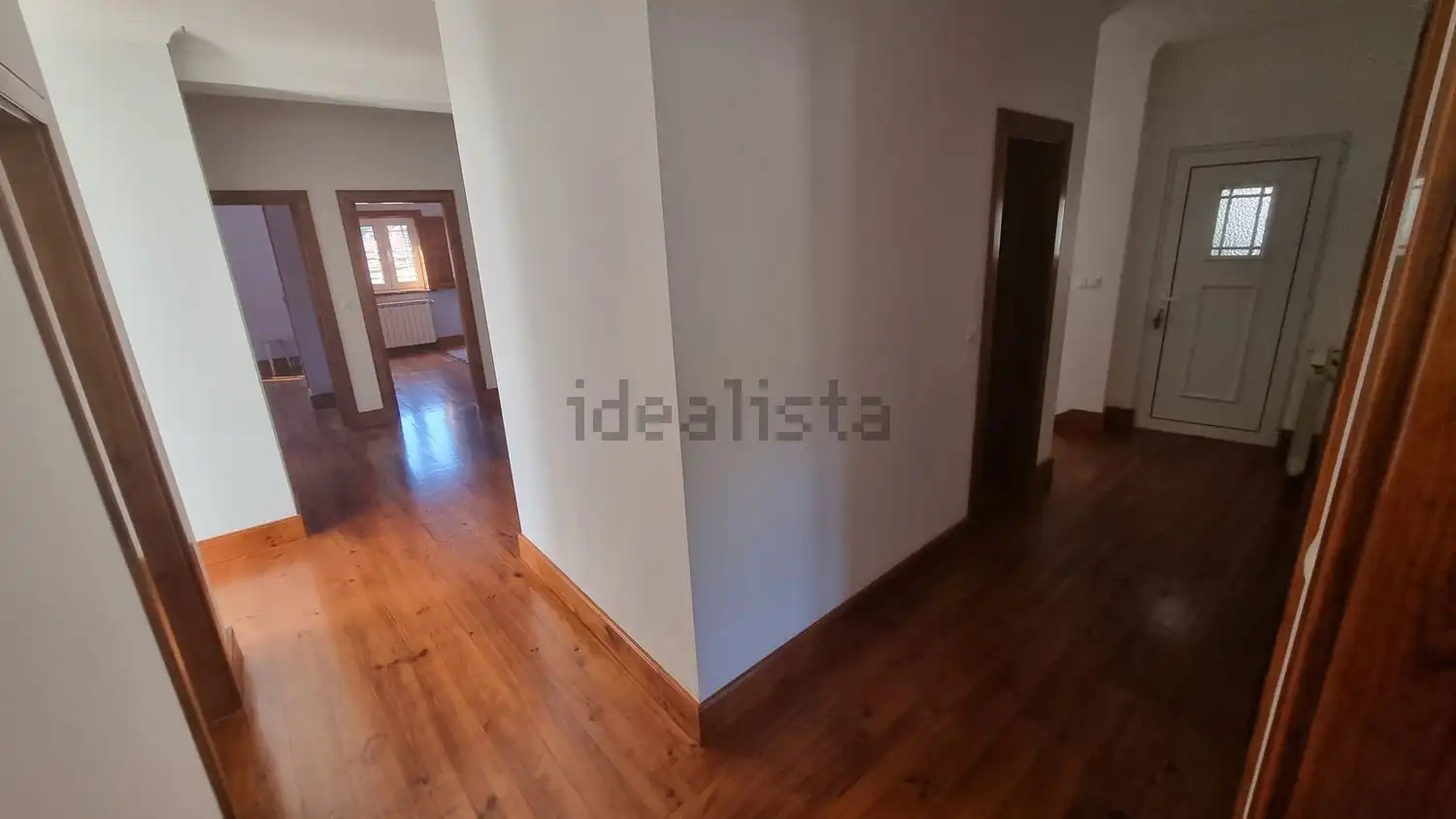 Spacious interior of a 4-bedroom house in Cortegaça, featuring wooden floors and bright living space.
