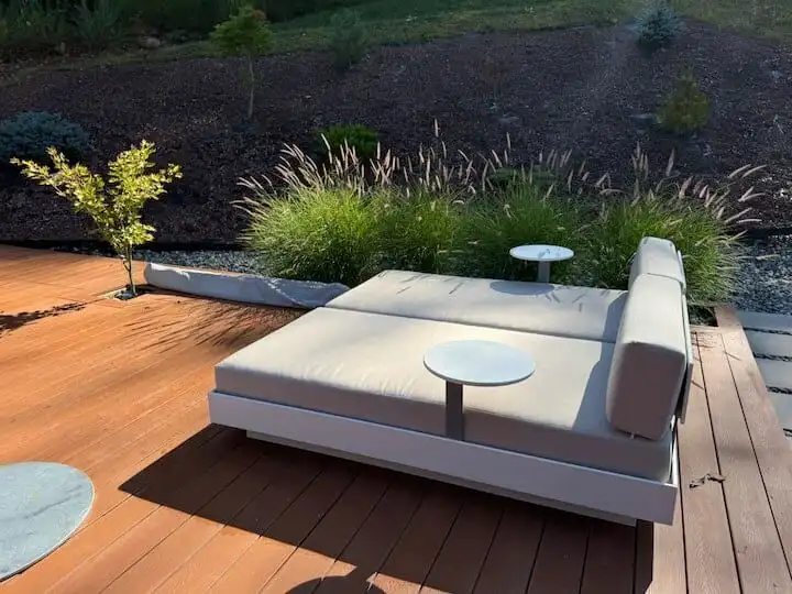 Outdoor lounge with garden view in Hanover, New Hampshire.