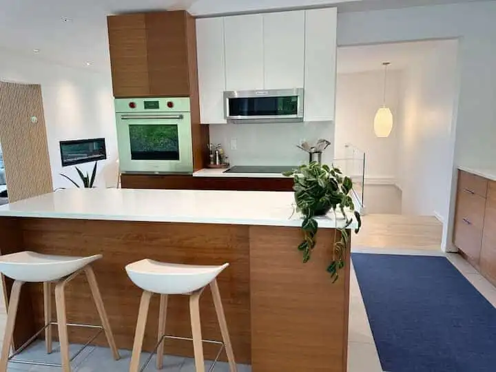 Elegant kitchen with modern appliances and wooden accents.