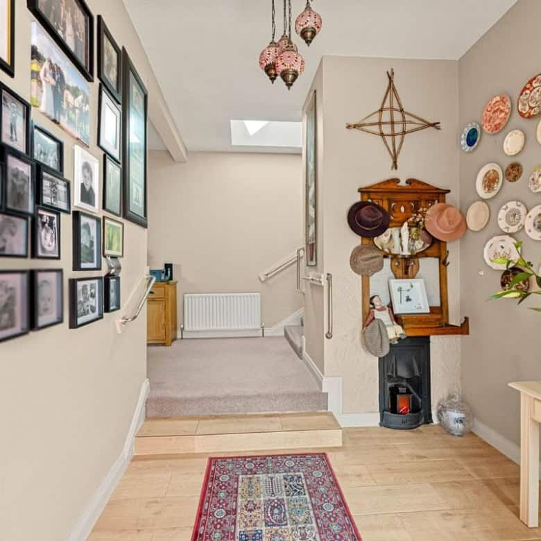 Cozy interior view of Springhill Lodge with decorative plates and family photos.