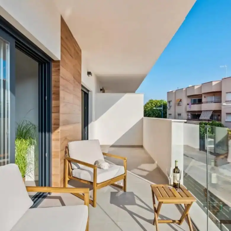 Spacious balcony of a 2-bedroom apartment in Santiago De La Ribera, Murcia, with outdoor seating and.