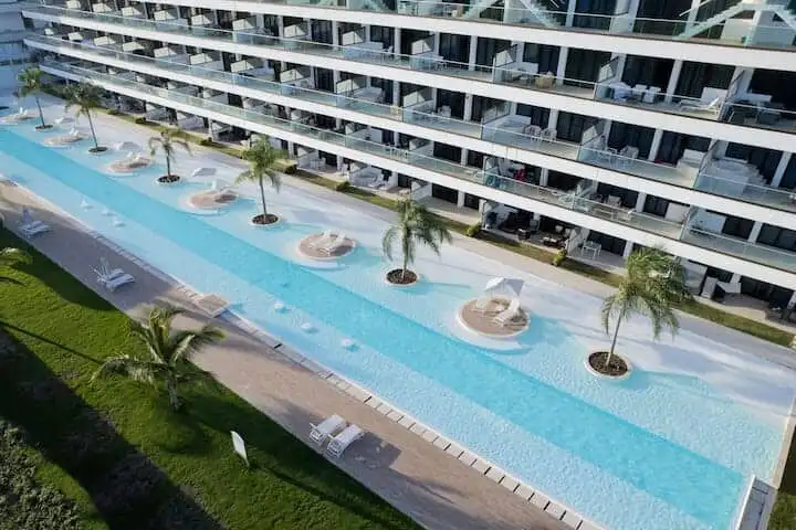 Poolside view of a luxury 2-bedroom apartment in Cana Rock STAR, Punta Cana.