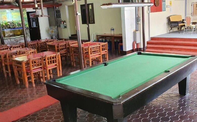 Hotel lounge featuring a pool table and seating area in Cavite, ideal for guests to unwind and socia.