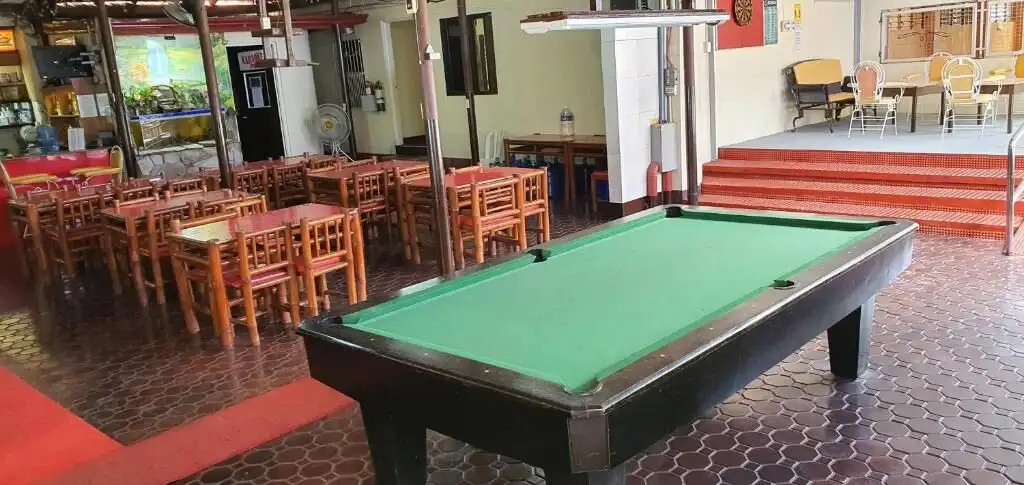 Hotel lounge featuring a pool table and seating area in Cavite, ideal for guests to unwind and socia.