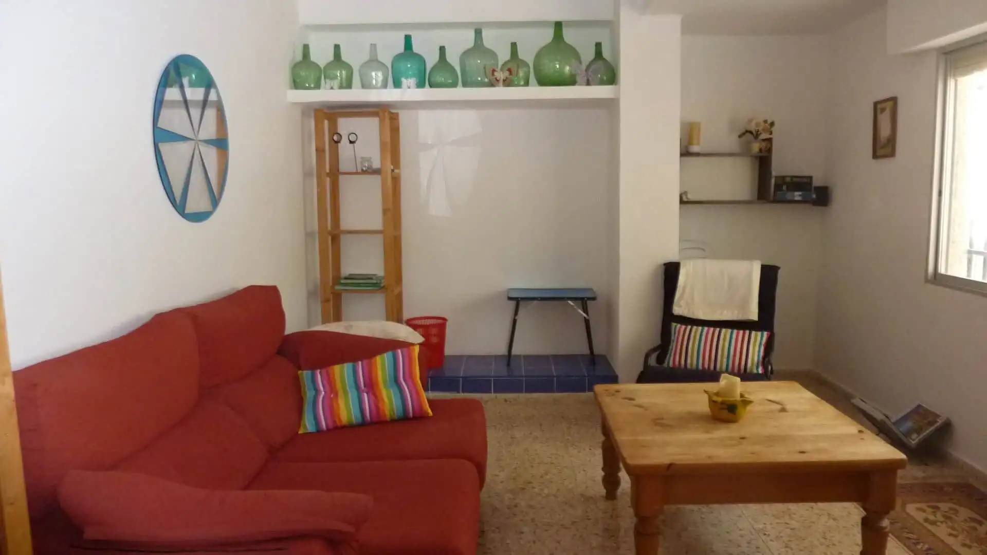 Bright living room with colorful decor in a Valencia villa for sale.