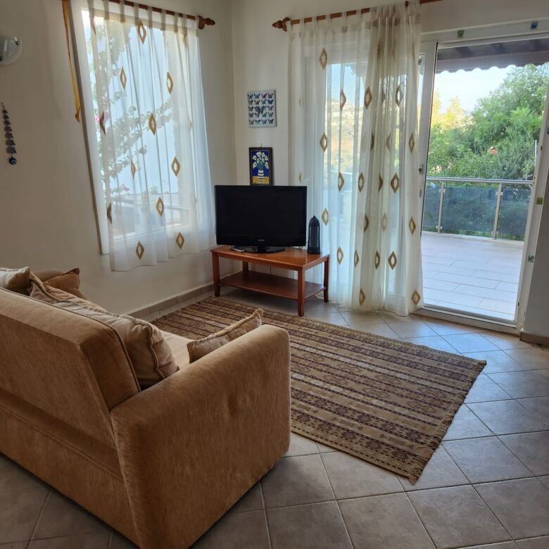Villa with spacious living room and sea view in Gumusluk.