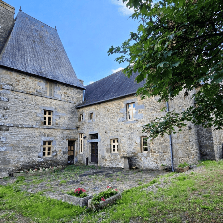 Charming stone manor house with five bedrooms in Normandy for sale. Historic property with spacious.