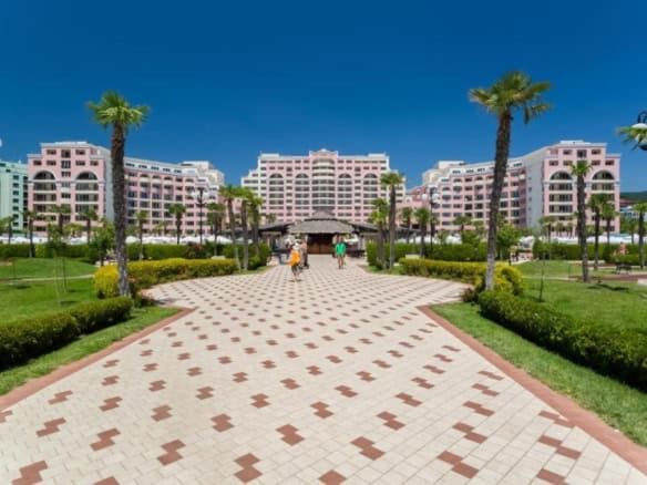 Modern resort complex with lush gardens and palm trees at Sunny Beach, Bulgaria.
