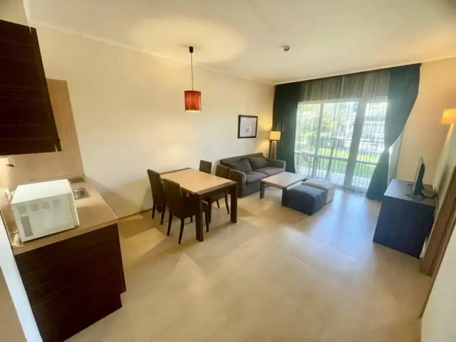Modern ground floor apartment in Majestic, Sunny Beach, 64 sq.m. Bright living room with large windows and balcony access.