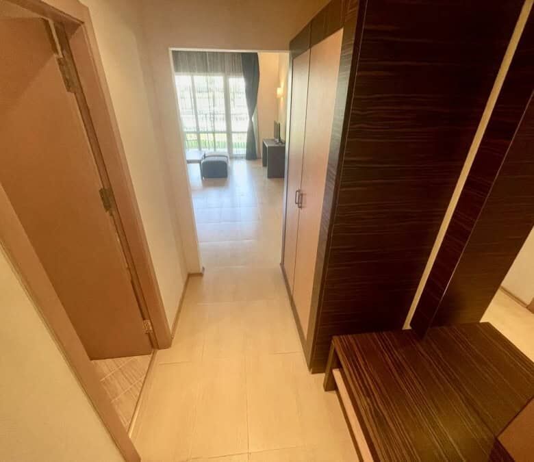 Bright interior with living area and balcony access.
