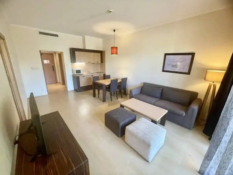 Modern 1-Bed Apartment in Majestic, Sunny Beach Bright living room of a 1-bedroom apartment in Majestic, Sunny Beach, with sofa, dining area, and ki.