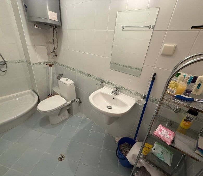 Clean, furnished bathroom with shower, toilet, and sink at Vineyards SPA Resort.