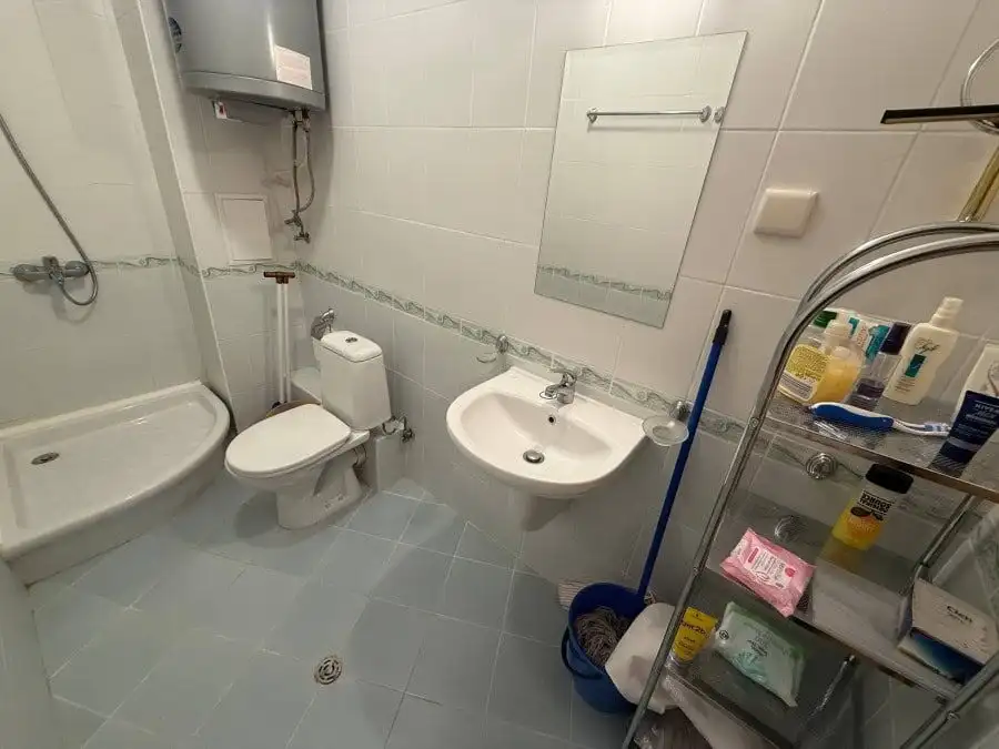 Clean, furnished bathroom with shower, toilet, and sink at Vineyards SPA Resort.