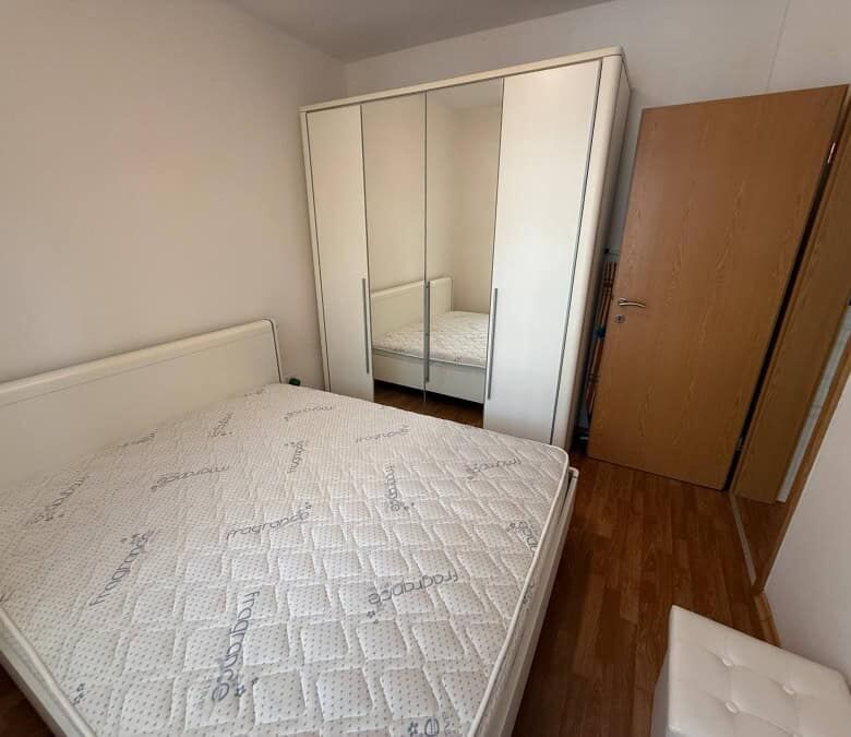 Furnished bedroom with double bed and wardrobe in Vineyards SPA Resort, 2 km from the sea.