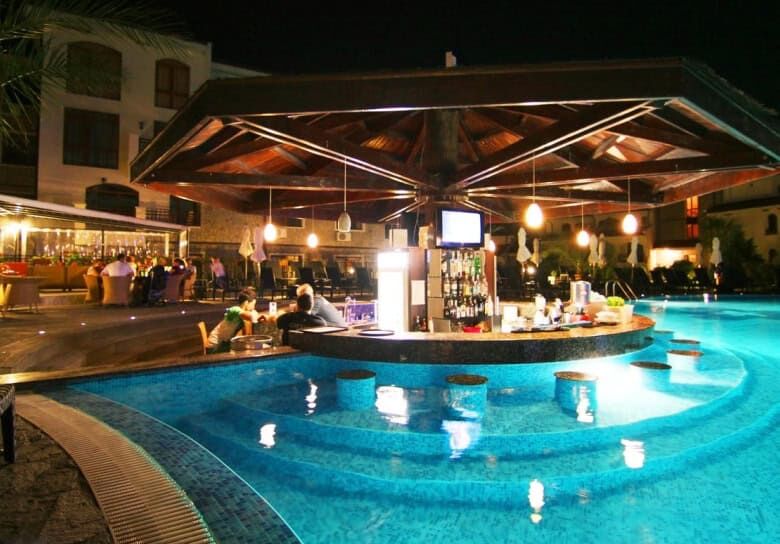 Poolside bar at Vineyards SPA Resort with relaxing ambiance and modern design.