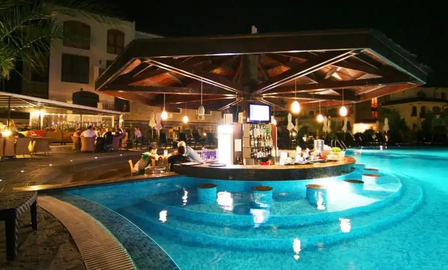 Poolside bar at Vineyards SPA Resort with relaxing ambiance and modern design.