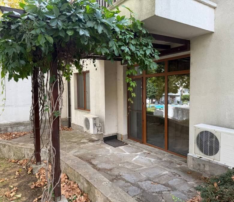 Furnished 1-bedroom apartment entrance with glass doors at Vineyards SPA Resort, 2 km from the sea.