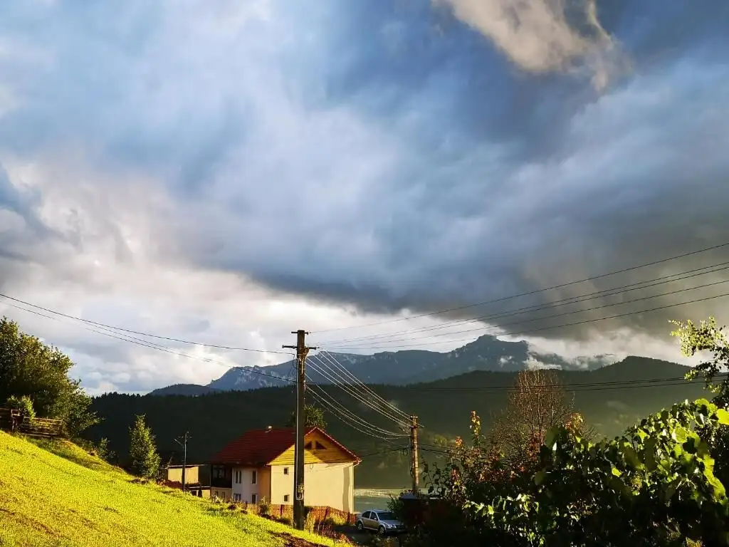 Two charming houses available for purchase in Bicaz, set against a scenic mountain backdrop. Ideal f.