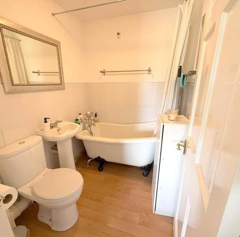 Elegant bathroom with vintage clawfoot tub and modern fixtures.