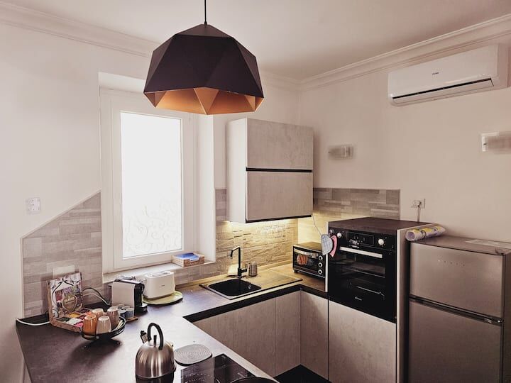 Spacious 3-bedroom apartment for sale in Frascati, Rome, featuring contemporary kitchen and bright l.