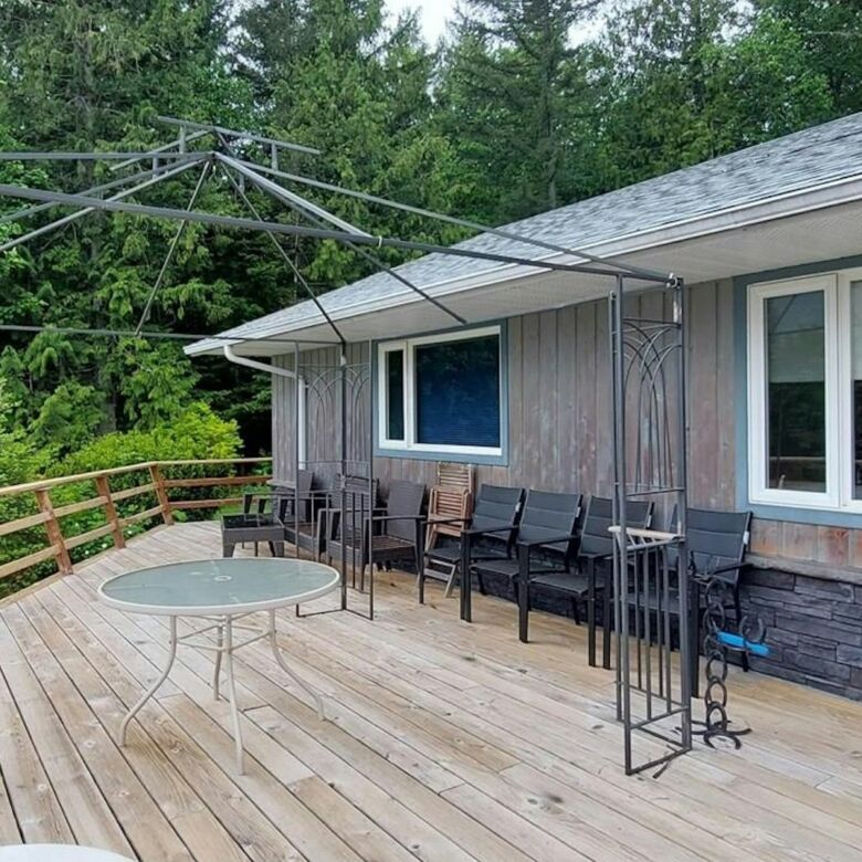 Spacious outdoor deck with seating and scenic views in Bella Coola, British Columbia.