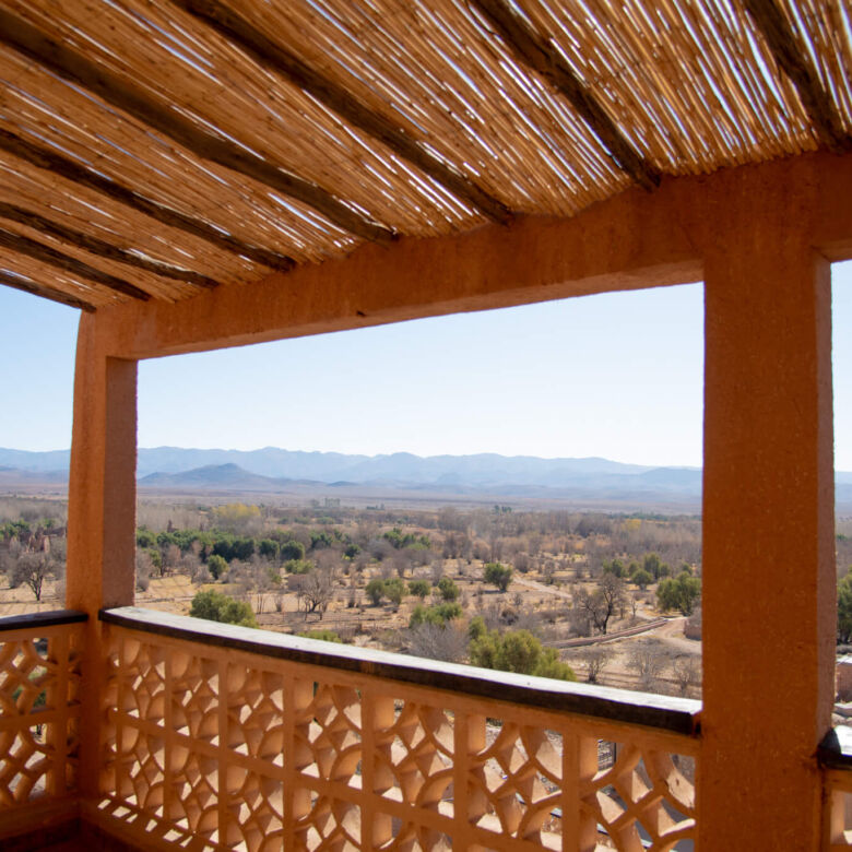 Hotel balcony overlooking desert landscape in Imzough, Morocco.