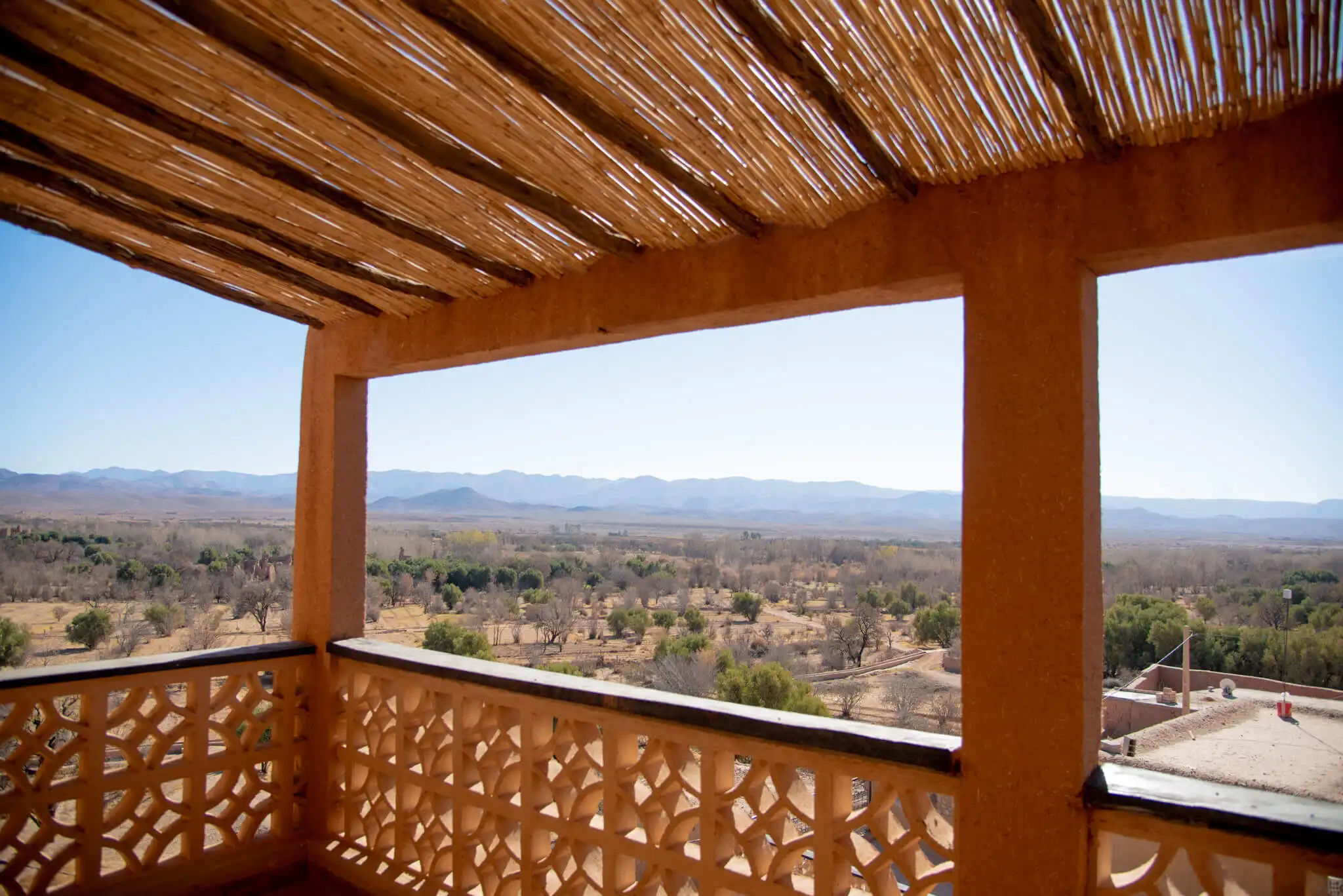 Hotel balcony overlooking desert landscape in Imzough, Morocco.