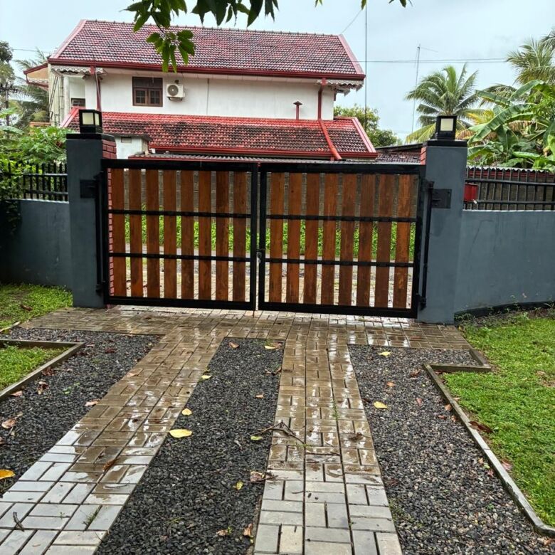 Charming estate featuring two houses available for sale in Waikkal, Sri Lanka, with lush surrounding.