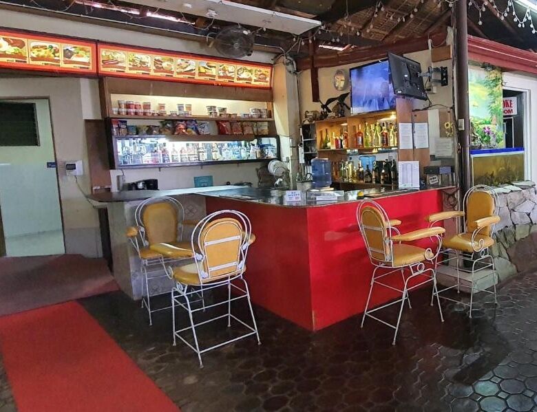 Charming resort hotel bar with vibrant decor and seating area in Cavite for sale.