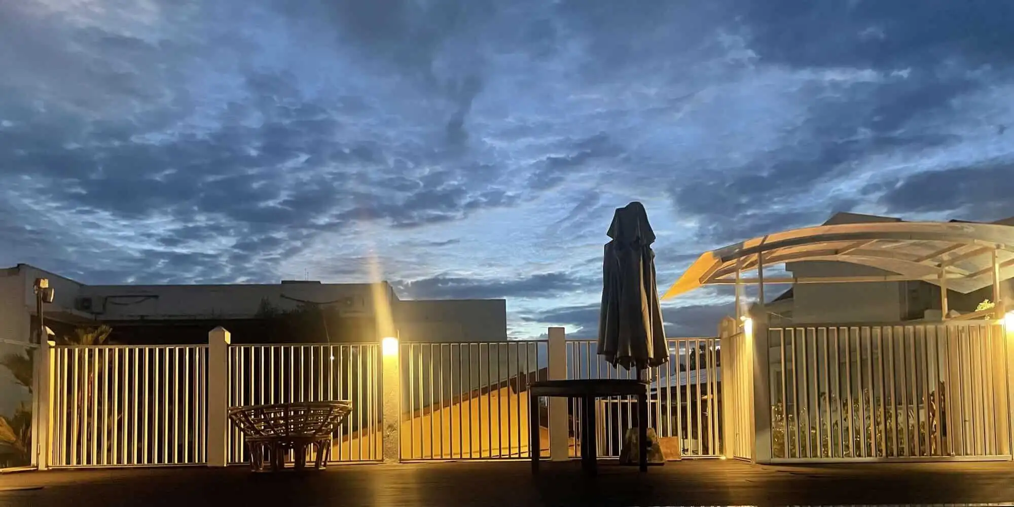 Modern Colombo house with outdoor terrace and scenic sky view.