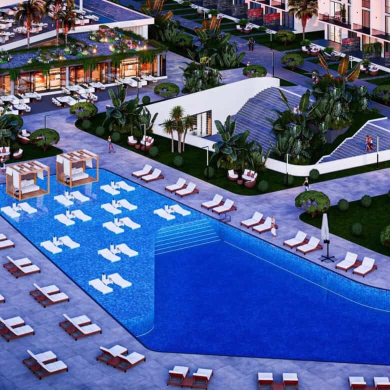 Poolside view of a luxury 1-bedroom apartment in Courtyard Platinum Bogaz Iskele North.