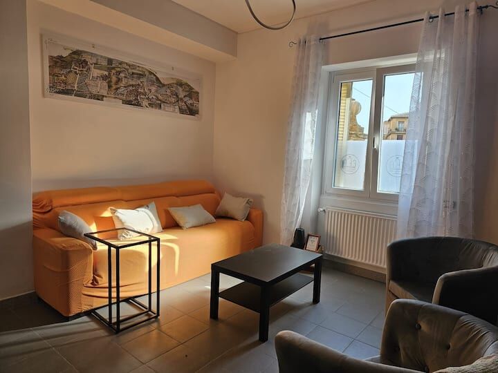 Bright living room with comfortable sofa and natural light.