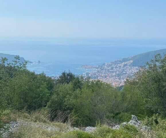 Beautiful land for sale in Budva with panoramic views of the Adriatic Sea and surrounding landscape.