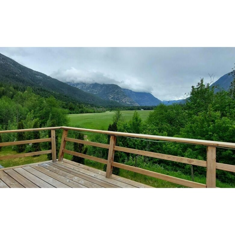 Beautiful mountain view from a spacious deck in Bella Coola, British Columbia. Perfect for nature lo.