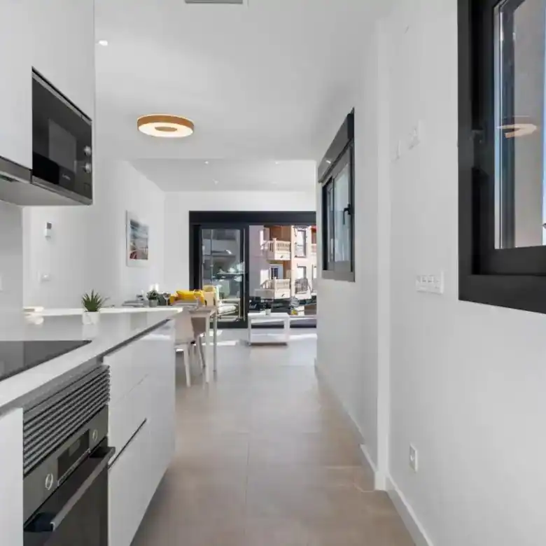 Modern kitchen in a stylish apartment in Santiago de la Ribera, Murcia, perfect for comfortable livi.