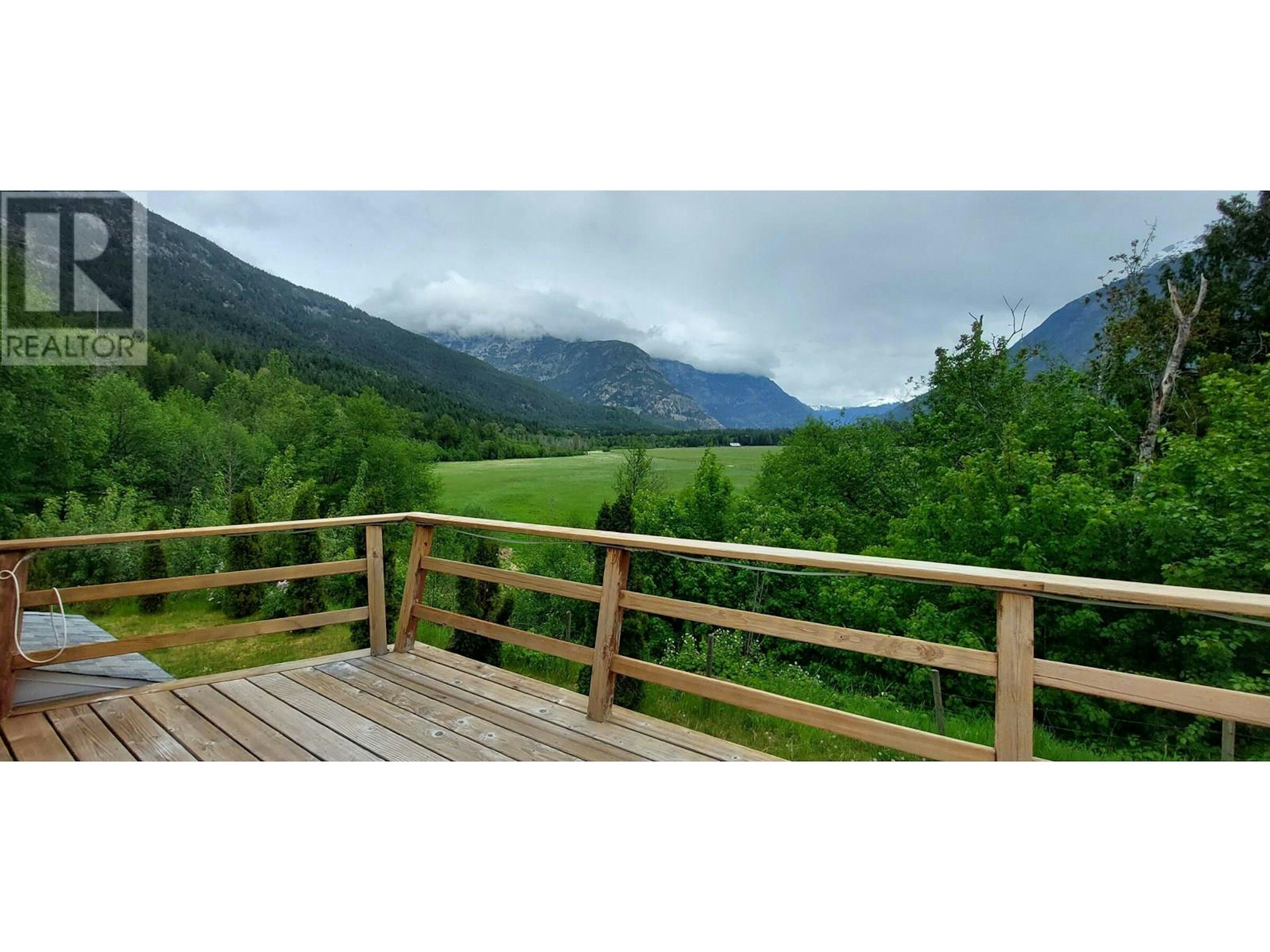 Stunning 4-Bed Estate in Bella Coola BC Beautiful mountain view from a spacious deck in Bella Coola, British Columbia. Perfect for nature lo.