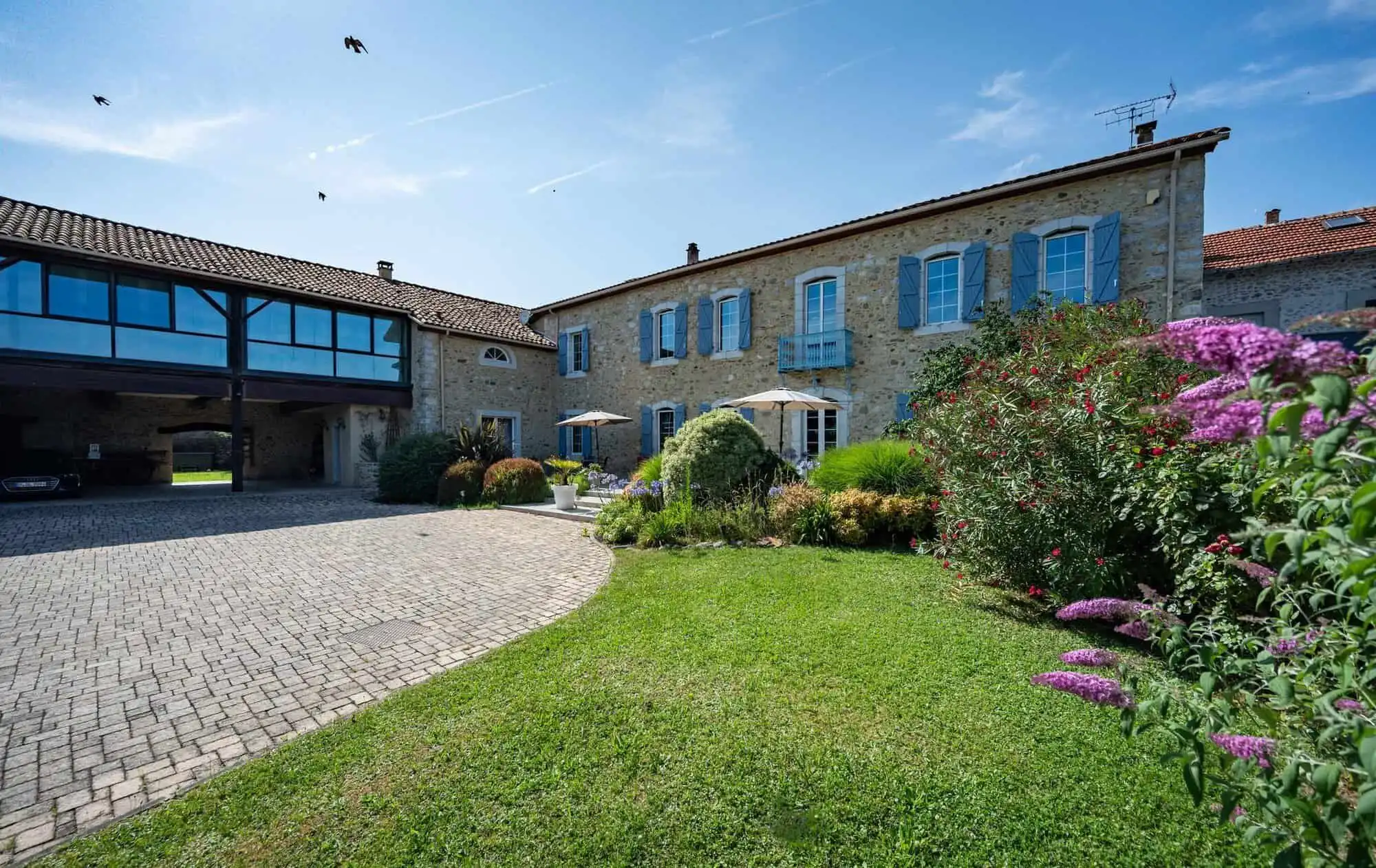 Built bed and breakfast with lush gardens in Ausson, Haute Garonne, perfect for a luxury lifestyle.